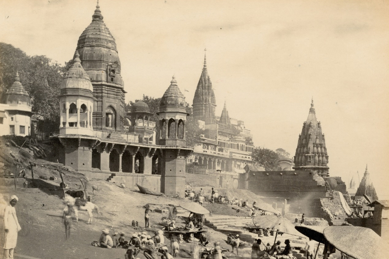 An Image of a temple in India beside a river