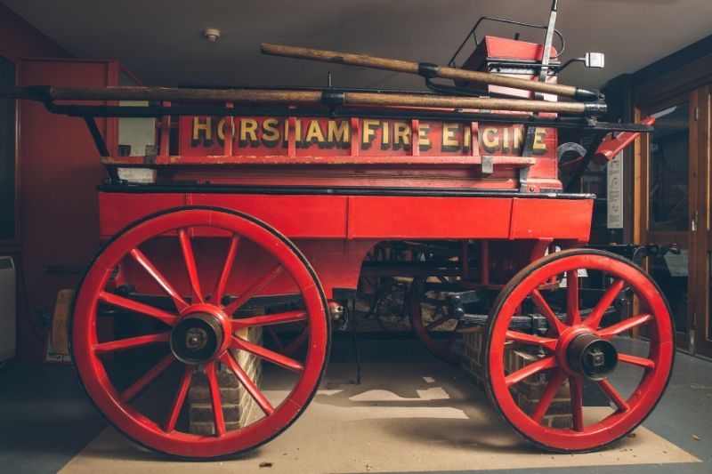 A Victorian fire engine with Horsham Fire Engine written on the side