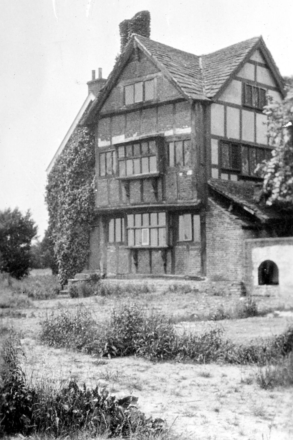 Black and white photograph of a half timbered building