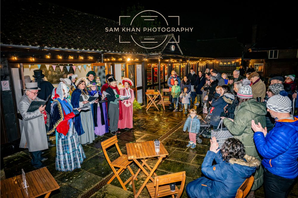 Image of two women against a background of Christmas lights