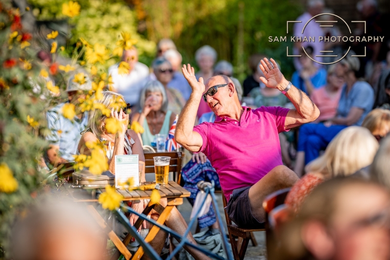 People celebrating in the museum garden