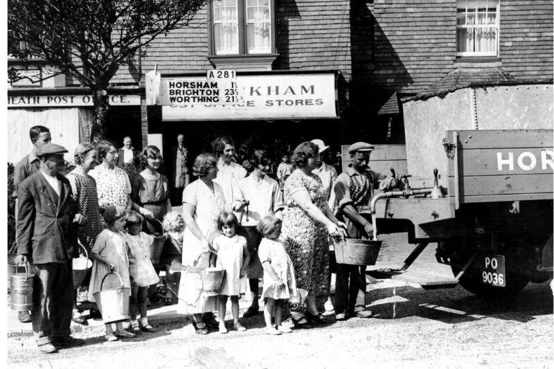 Water cart & queue outside Broadbridge Heath Post Office in 1934.