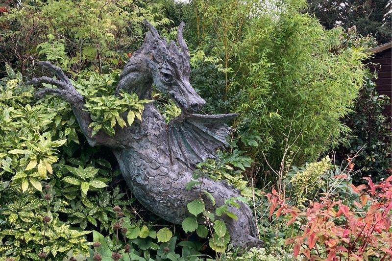 Dragon statue in foliage