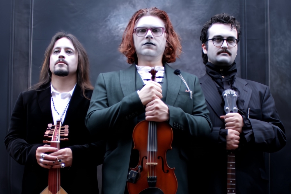 Three men standing with musical instruments