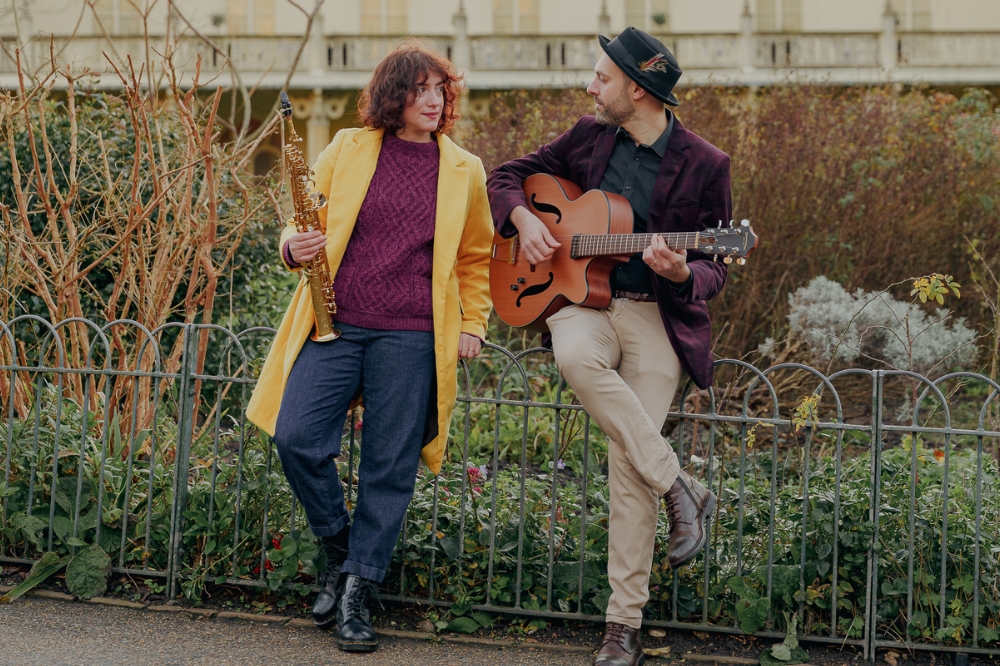 A woman and a man standing in front of Brighton Pavilion