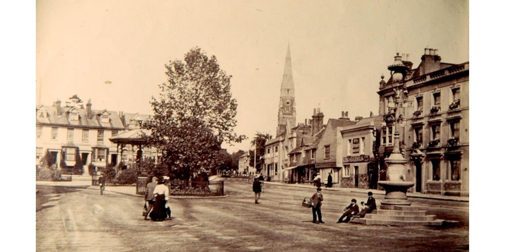 Sepia postcard of the Carfax, Horsham.