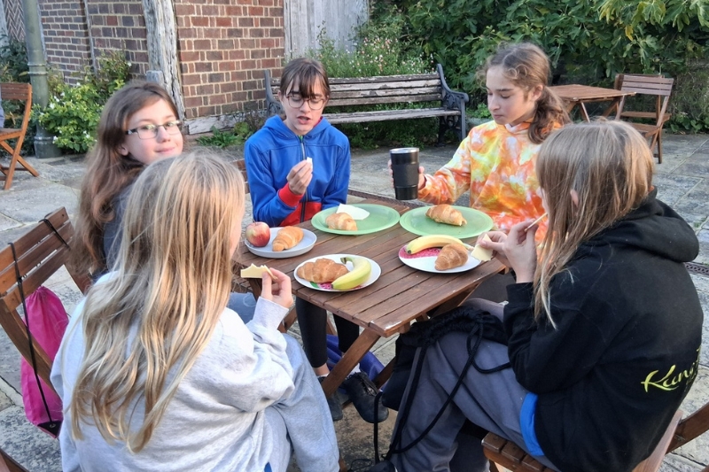 Guides enjoy breakfast in the museum garden