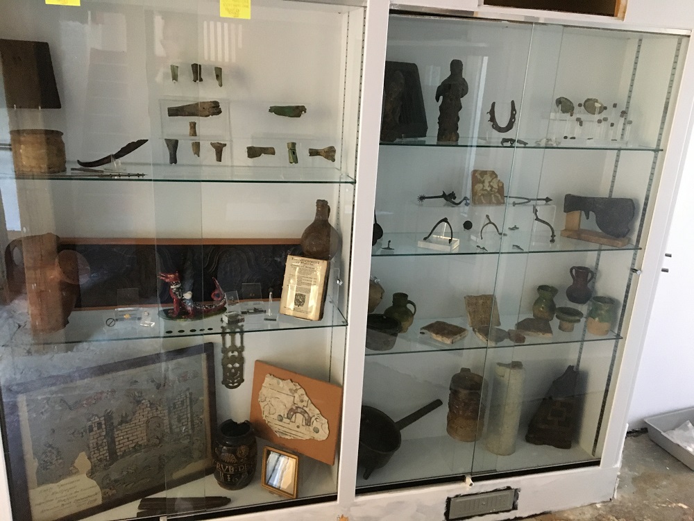 Saxon jewellery is displayed in a white and glass cabinet