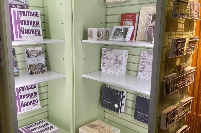 A photograph of the local books for sale in Horsham Museum shop