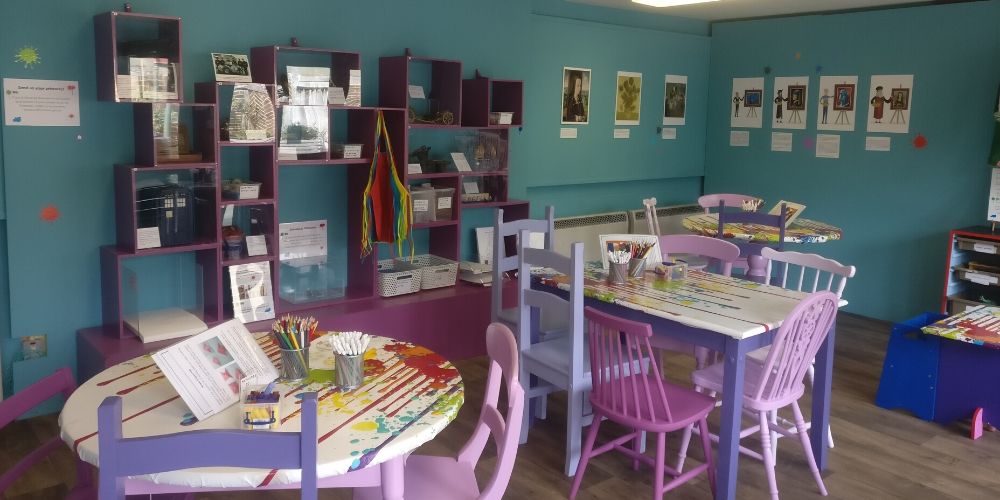 The Children's Art Zone is a colourful, light space set up for learning and play
